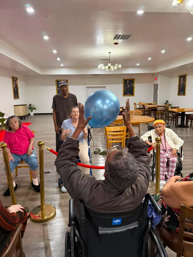 Older adults taking part in a group activity at a senior living community